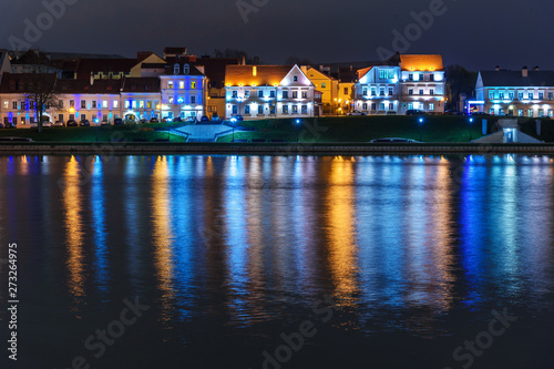 Traetskae Pradmestse or Trinity Suburb on Svisloch river bank at night. Minsk. Belarus photo