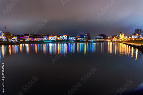 Traetskae Pradmestse or Trinity Suburb on Svisloch river bank at night. Minsk. Belarus photo