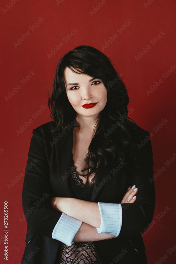 portrait of brunette business woman in suit on red background portrait of brunette business woman in suit on red background