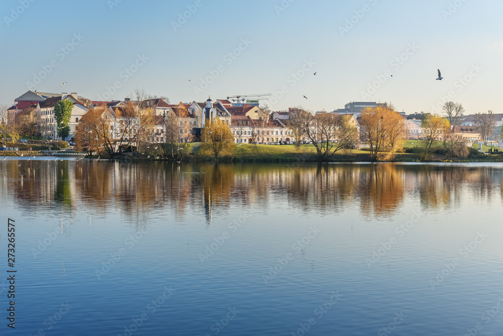 View of Traetskae Pradmestse or Trinity Suburb and Island of Tears Chapel or Island of Courage and Sorrow on Svisloch river bank in Minsk. Belarus