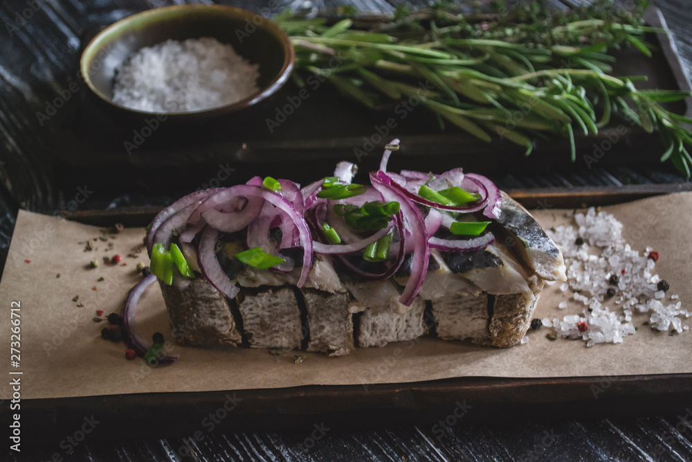 The sandwich with herring fish and onion. The sandwich with herring fish and onion.