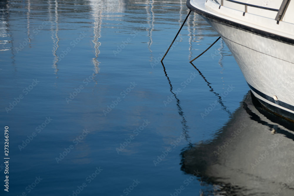 Reflections in the tranquil water of the fishing harbour Reflections in the tranquil water of the fishing harbour