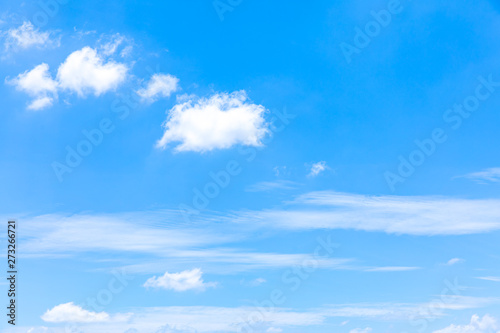 Deep blue sunny sky with white clouds. Blue sky with cloud closeup. White fluffy clouds in the blue sky. © S@photo