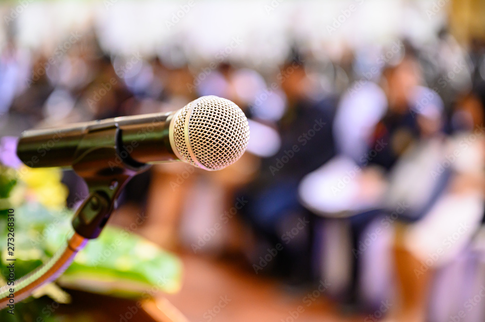 Microphone over the blurred business forum Meeting or Conference Training Learning Coaching Room Concept, Blurred background. Microphone over the blurred business forum Meeting or Conference Training Learning Coaching Room Concept, Blurred background.