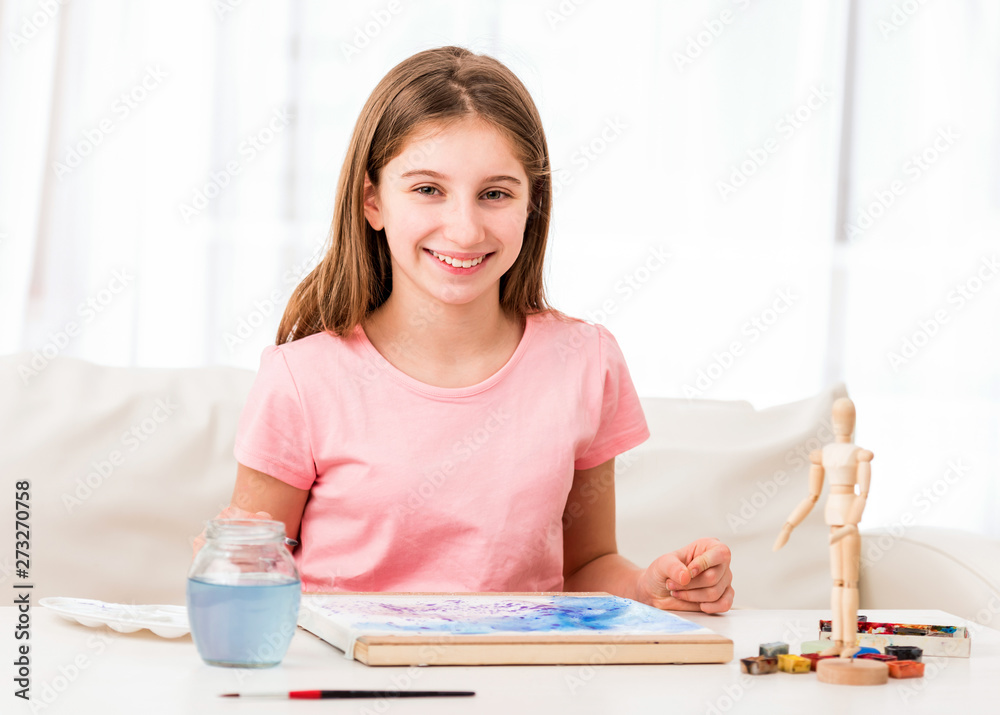 Teen is happy about her paint work Teen is happy about her paint work