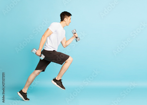 Full length portrait of young fitness man running © Tom Wang