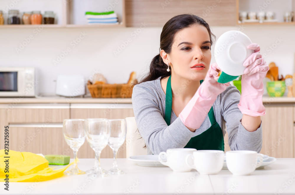 Young female contractor doing housework Young female contractor doing housework
