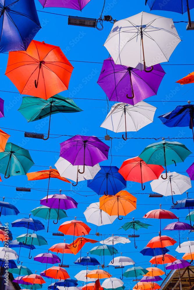 hanging umbrellas against the blue sky, walk through the streets of Kaleici, Antalya
