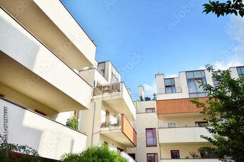 Multistory new modern apartment building. Stylish living block of flats.