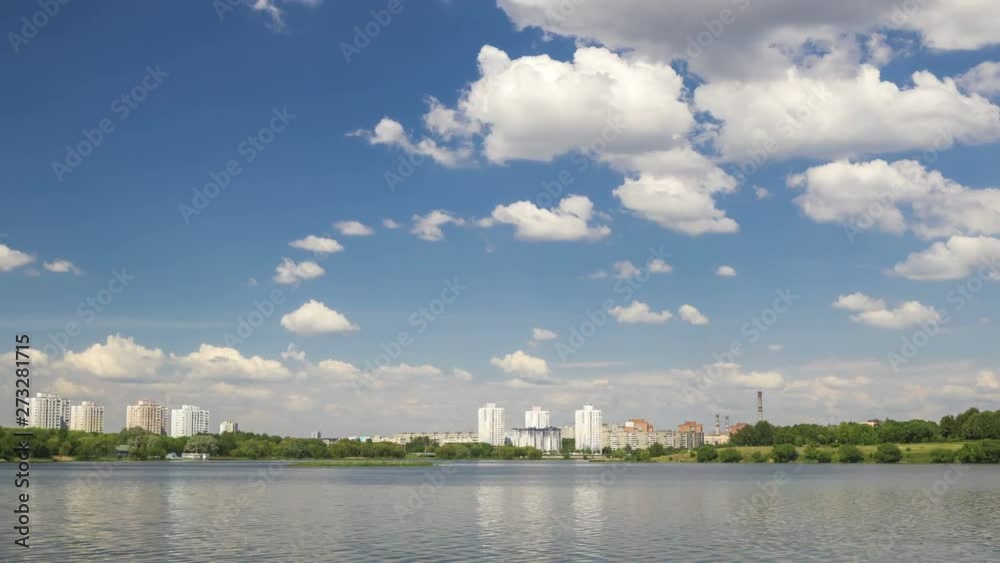 Cumulonimbus clouds over lake, city lake in Minsk, time lapse. Cumulonimbus clouds over lake, city lake in Minsk, time lapse.