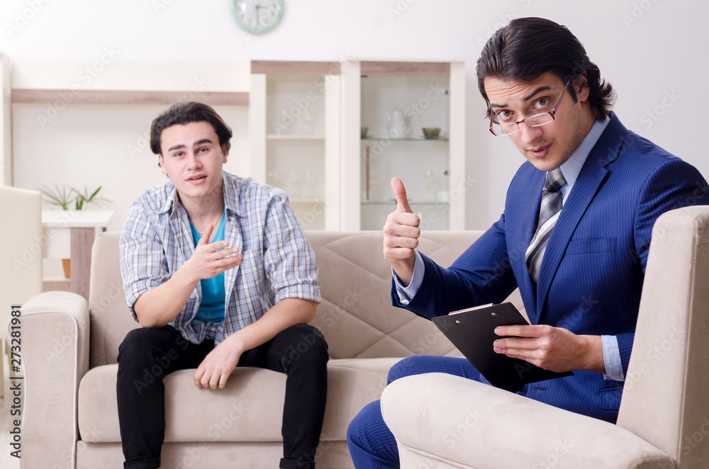Young male patient discussing with psychologist personal problem Young male patient discussing with psychologist personal problem