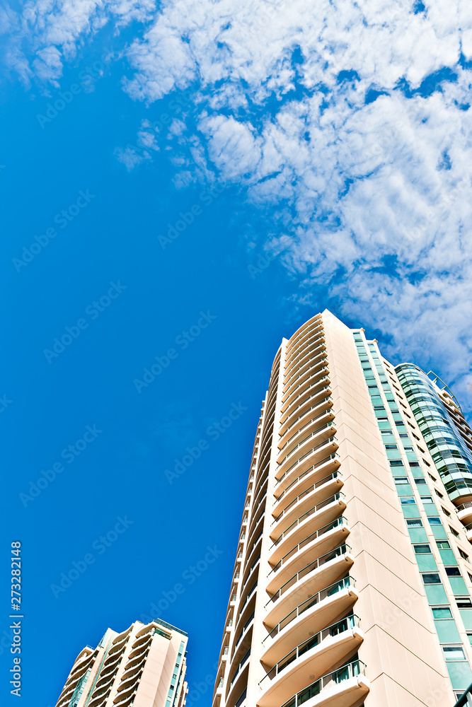 Low angle shot of a tall building  with blue sky
