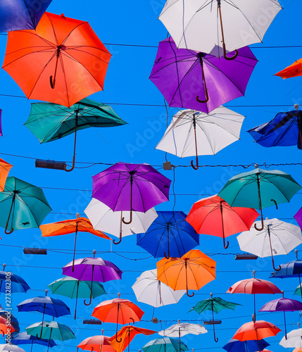 hanging umbrellas against the blue sky, walk through the streets of Kaleici, Antalya