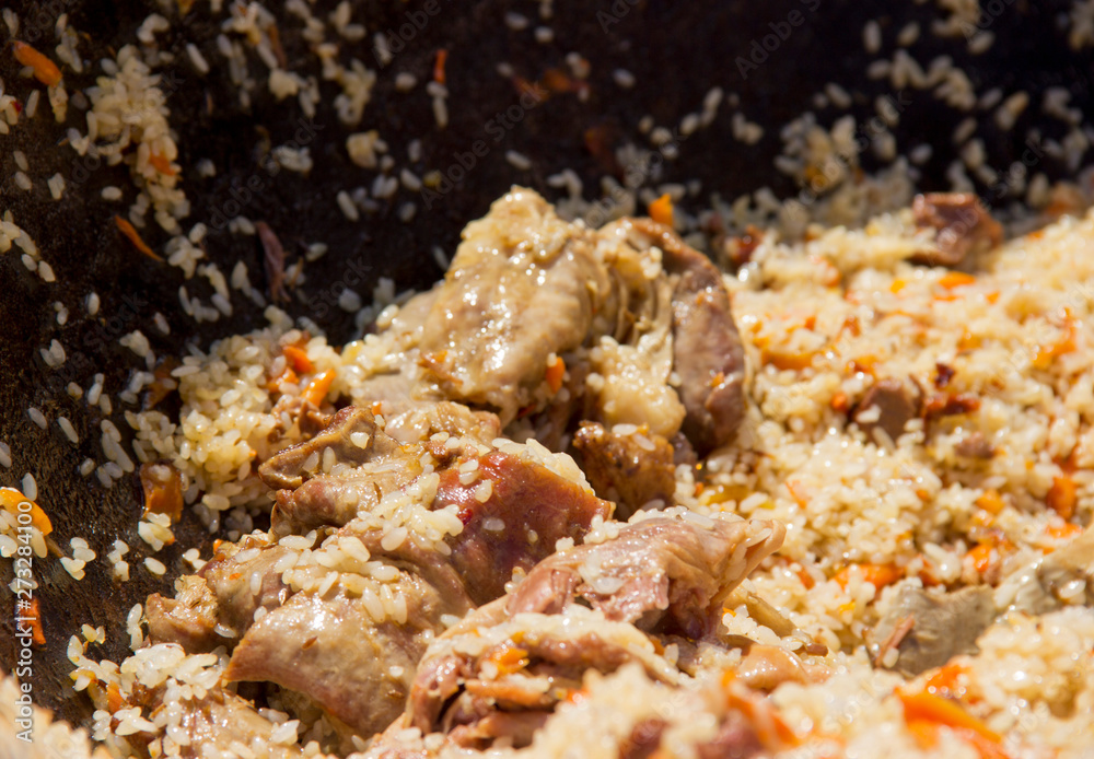 cooking delicious pilaf in a cauldron in the fresh air cooking delicious pilaf in a cauldron in the fresh air