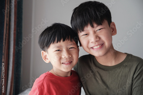Asian little brother and big brother at home , Happy children portrait