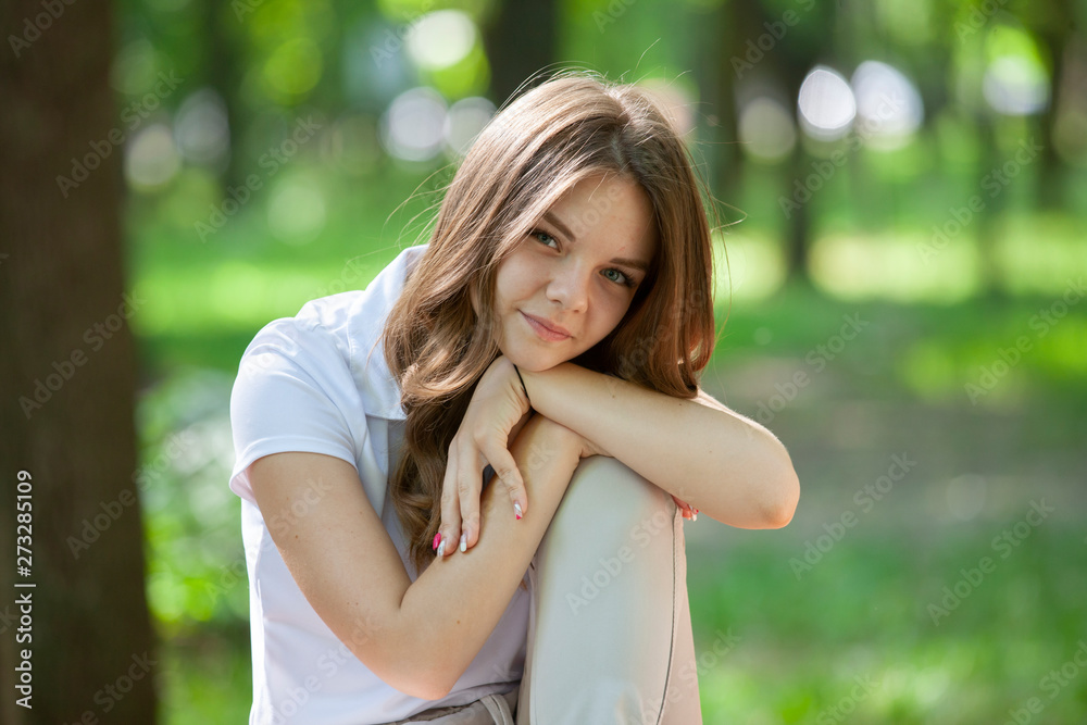 Outdoors portrait of beautiful young brunette girl. Outdoors portrait of beautiful young brunette girl.