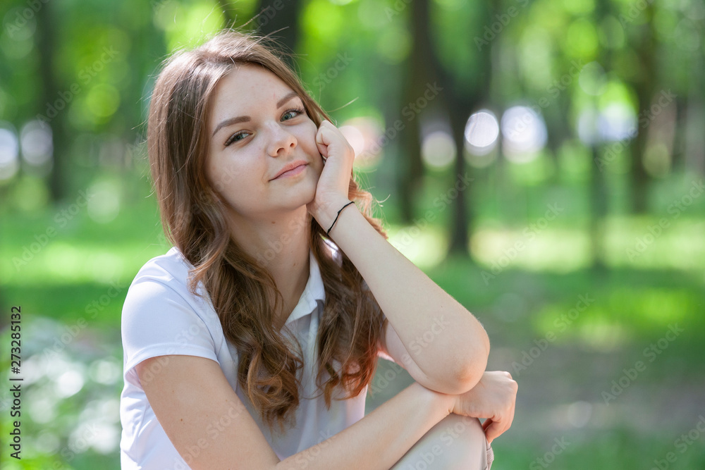 Outdoors portrait of beautiful young brunette girl. Outdoors portrait of beautiful young brunette girl.