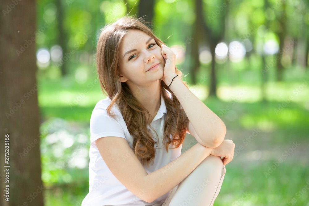 Outdoors portrait of beautiful young brunette girl. Outdoors portrait of beautiful young brunette girl.