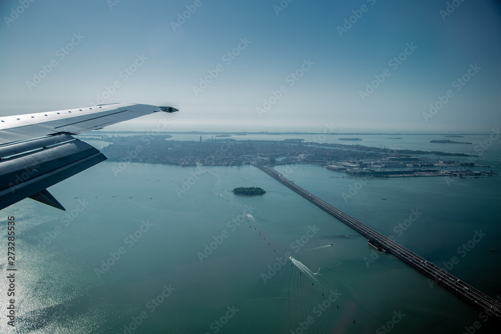 View from the plane to the bridge and Venice, Italy