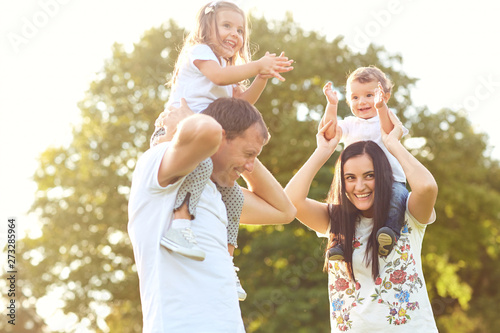 Happy family with children in the park. 