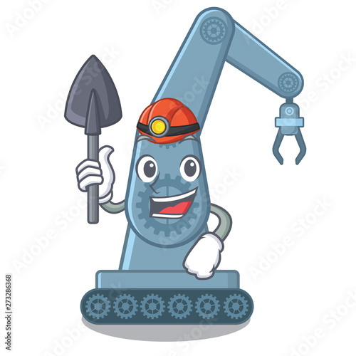 Miner mechatronic robot arm above cartoon table