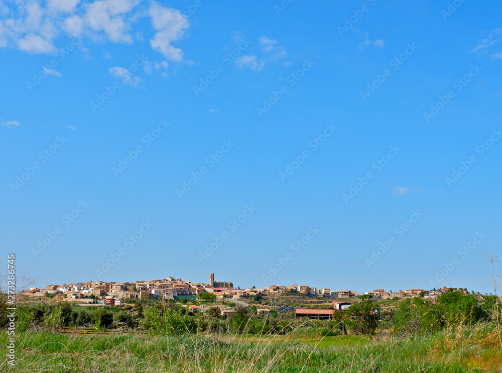 View from far of Cretas village, Aragon, Spain. Thin horizon line and blue sky domination. Landscape background with big place for text 