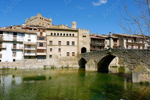 View of the river Mataranya, the bridge and the entrance to the city of Valderrobres, province of Teruel, Aragon. photo