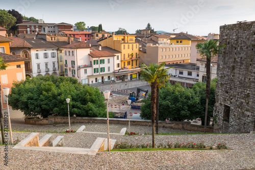 Urbanization works in the historic center of a Swiss city. Mendrisio, square del Ponte in front of the church of Santi Cosma e Damiano at sunset