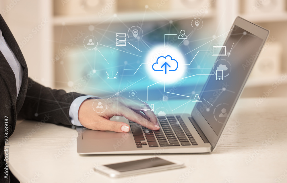 Business woman in homey environment using laptop with online storage and cloud technology concept
Business woman in homey environment using laptop with online storage and cloud technology concept