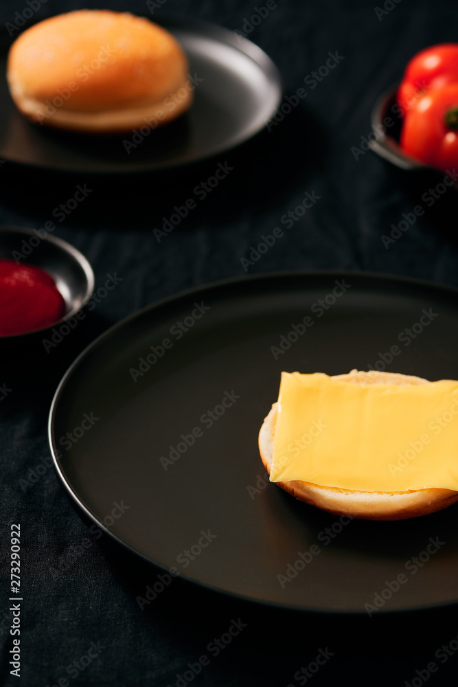 Process making of burger, step by step isolated on black background. Burger wide banner. Split burger. Burger divided in parts Process making of burger, step by step isolated on black background. Burger wide banner. Split burger. Burger divided in parts
