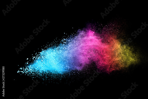 Multi color powder explosion isolated on black background. 