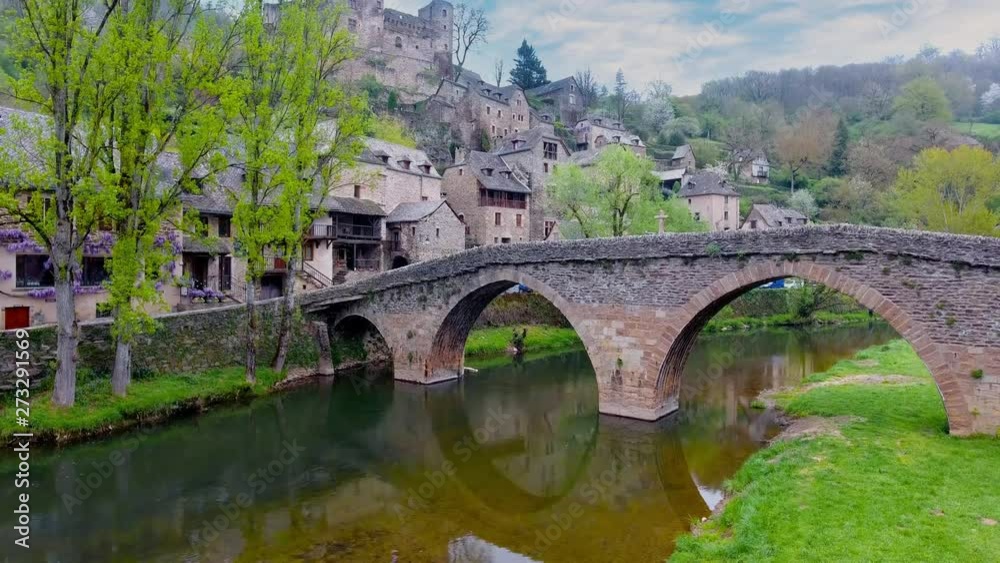 Flight crossing Aveyron river and old stone bridge on the medieval village of Belcastel, Aveyron, France. Flight crossing Aveyron river and old stone bridge on the medieval village of Belcastel, Aveyron, France.