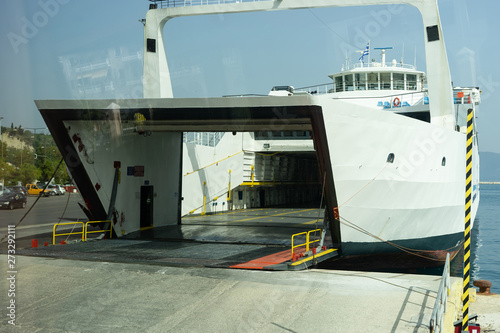 Ferryboat ready to load unloaded vehicles at the port dock