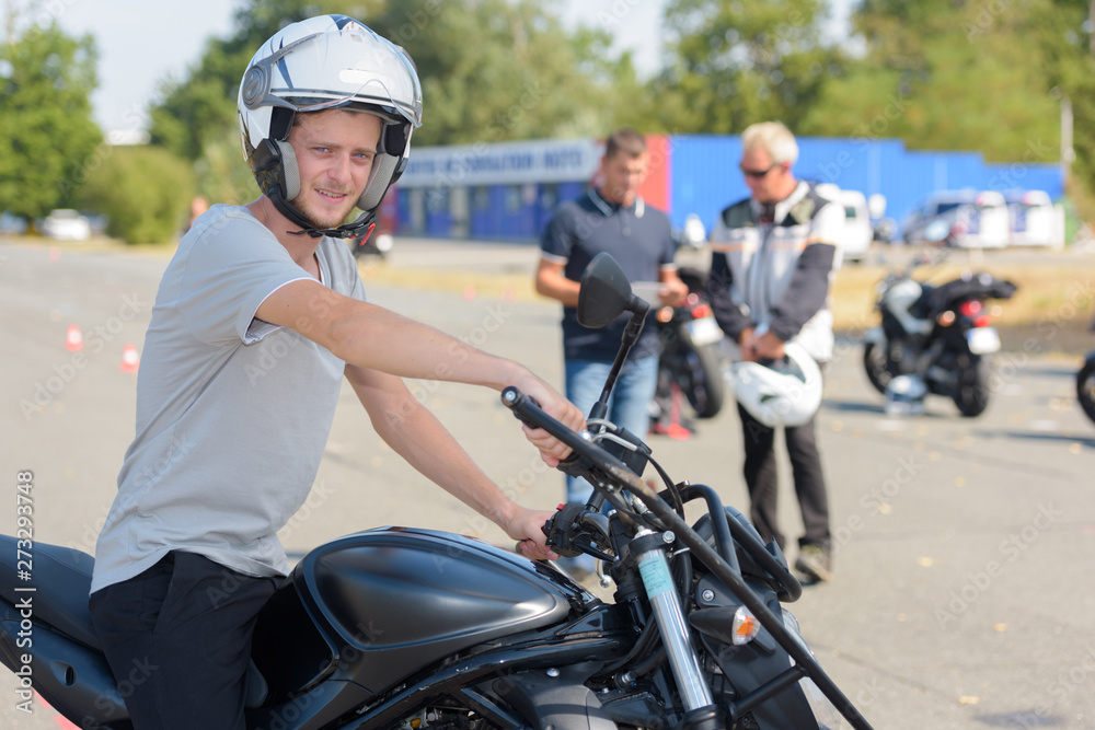 young man doing his motorbike test young man doing his motorbike test