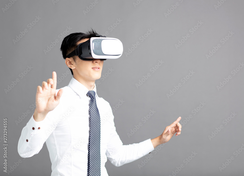 Portrait of young businessman in vr goggles Portrait of young businessman in vr goggles