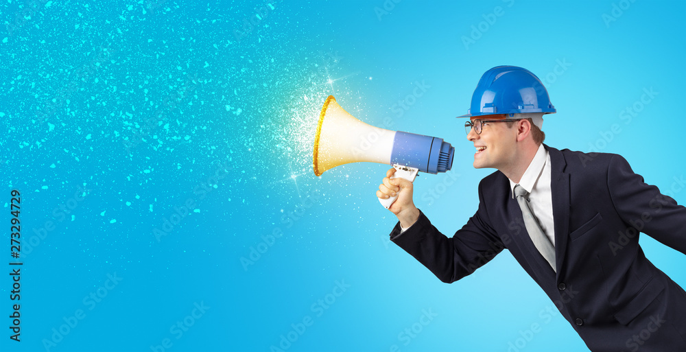 Fototapeta premium Young architect constructor yelling with megaphone and sparkling sounds 