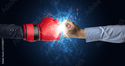 Two hands fighting with light, glow, spark and smoke concept  © ra2 studio