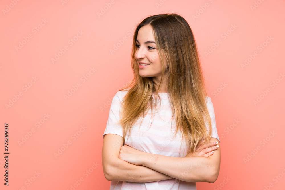 Young woman over isolated pink wall looking to the side Young woman over isolated pink wall looking to the side