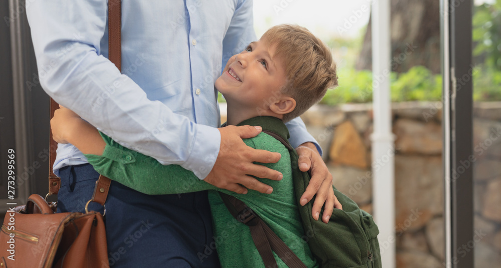 Fototapeta premium Son embracing his father in a comfortable home