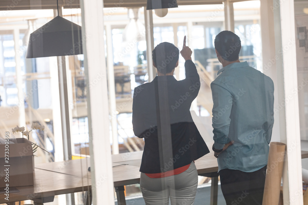 Architects interacting with each other in a modern office Architects interacting with each other in a modern office