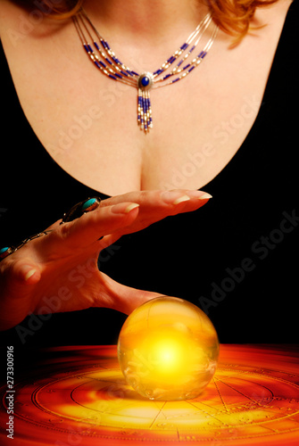 astrologer fortune teller with astrology horoscope and crystal ball like esoteri and magic concept 
