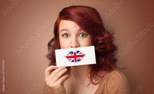 Person holding UK flag lips shape card 