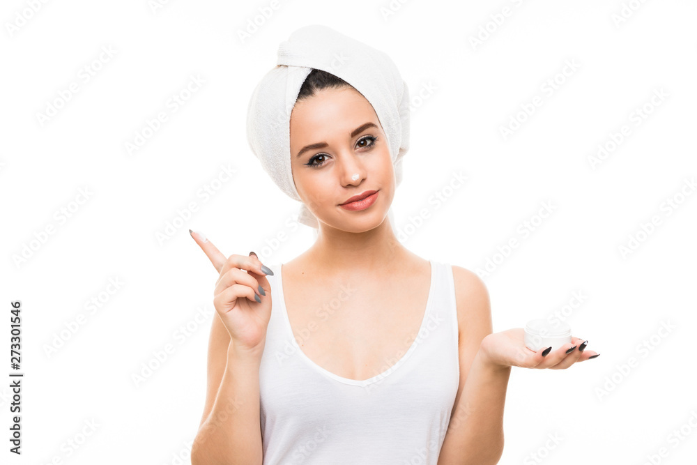 Young woman over isolated white background with moisturizer Young woman over isolated white background with moisturizer