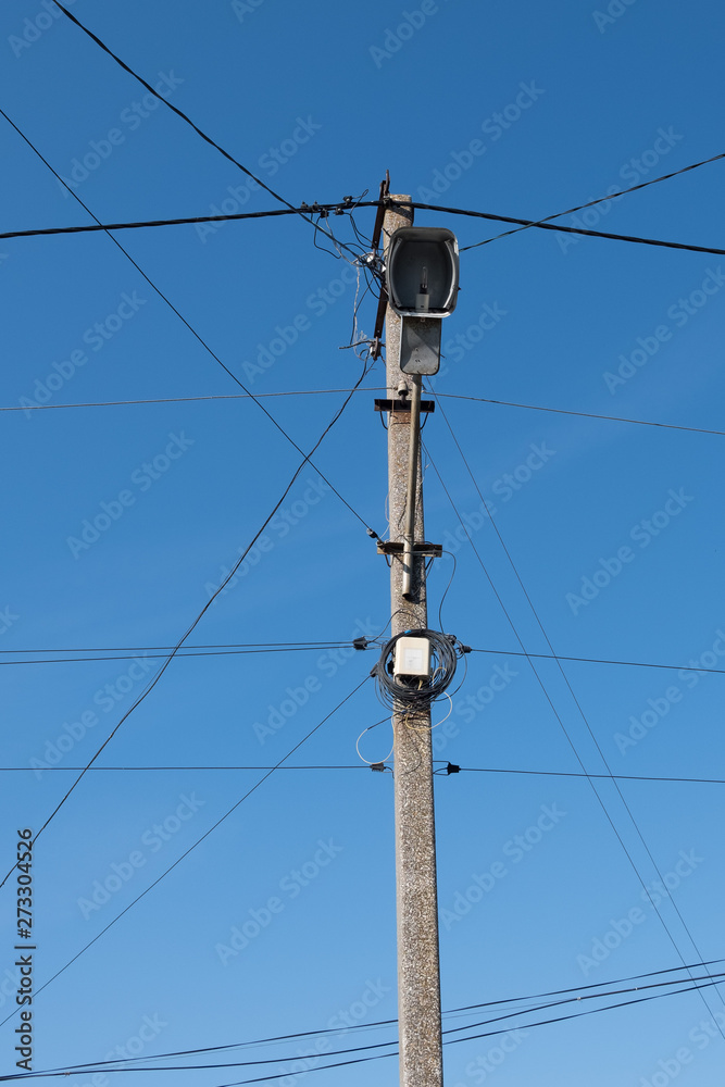 Street lamppost with wires. Concrete pole with a lantern. Street lamp without lamp. Street lamppost with wires. Concrete pole with a lantern. Street lamp without lamp.