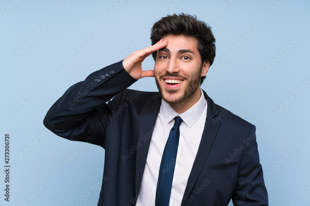 Businessman over isolated blue wall has just realized something and has intending the solution Businessman over isolated blue wall has just realized something and has intending the solution