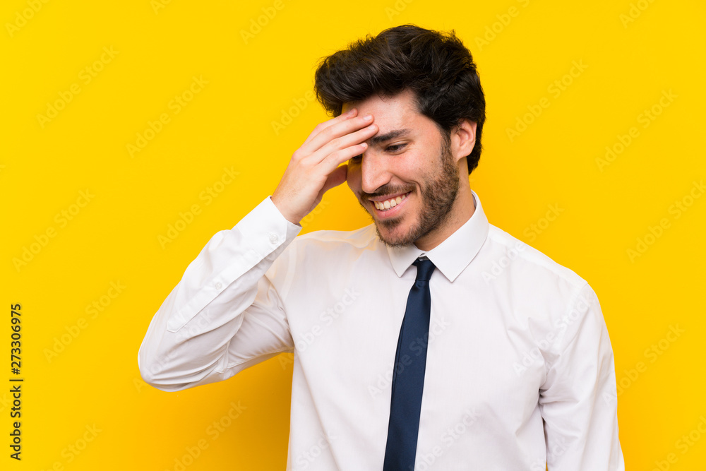 Businessman on isolated yellow background laughing Businessman on isolated yellow background laughing