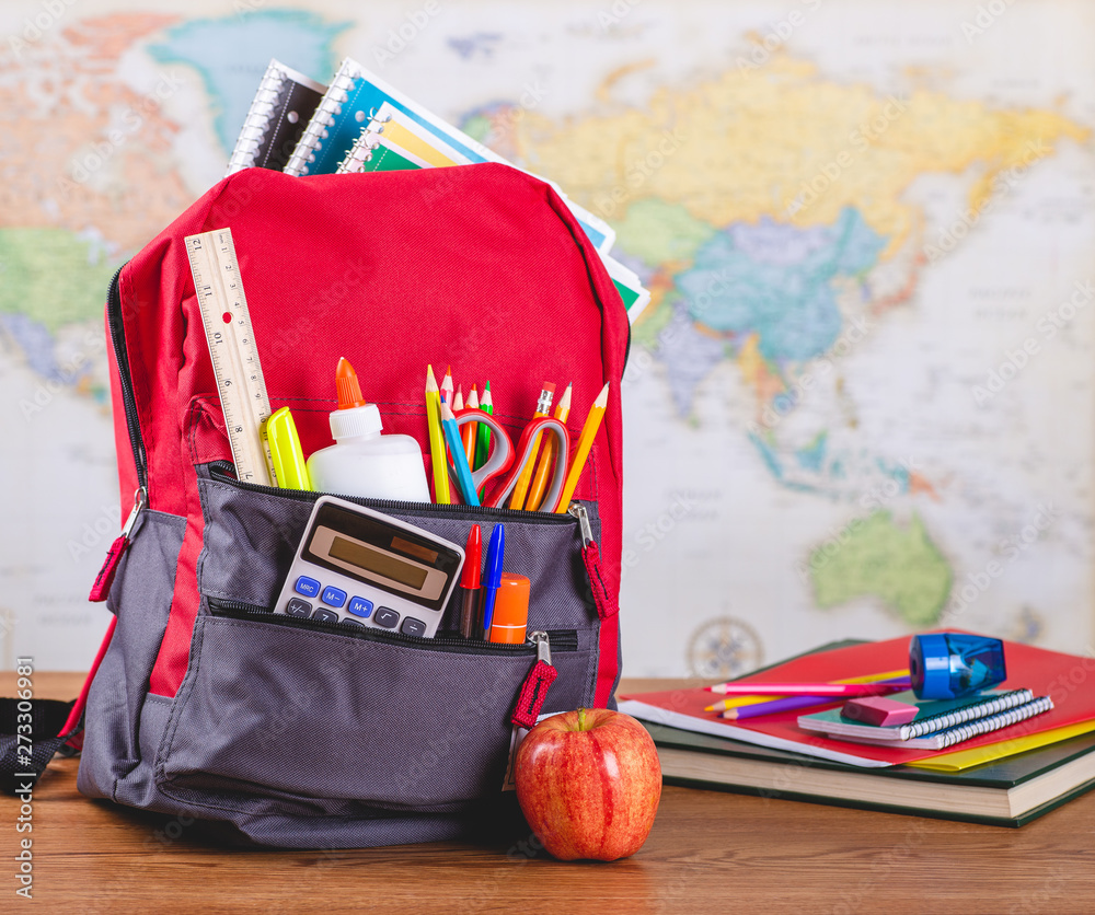 Backpack With School Supplies on a Desk - obrazy, fototapety, plakaty 