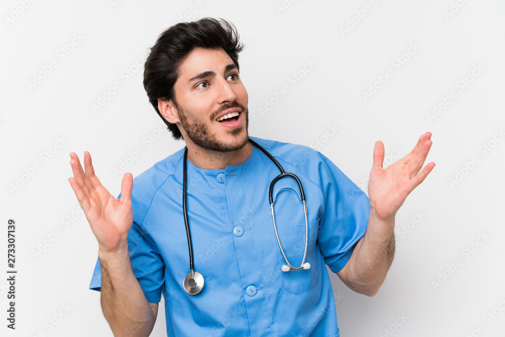 Surgeon doctor man over isolated white wall with surprise facial expression Surgeon doctor man over isolated white wall with surprise facial expression