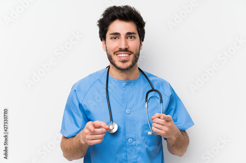 Surgeon doctor man over isolated white wall points finger at you