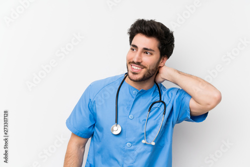 Surgeon doctor man over isolated white wall laughing